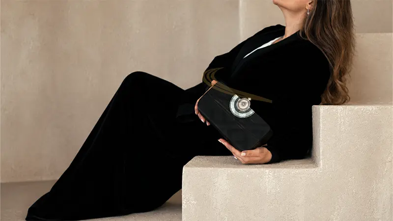 Trove Misk Black Bag in Model Hand Studio Stairs